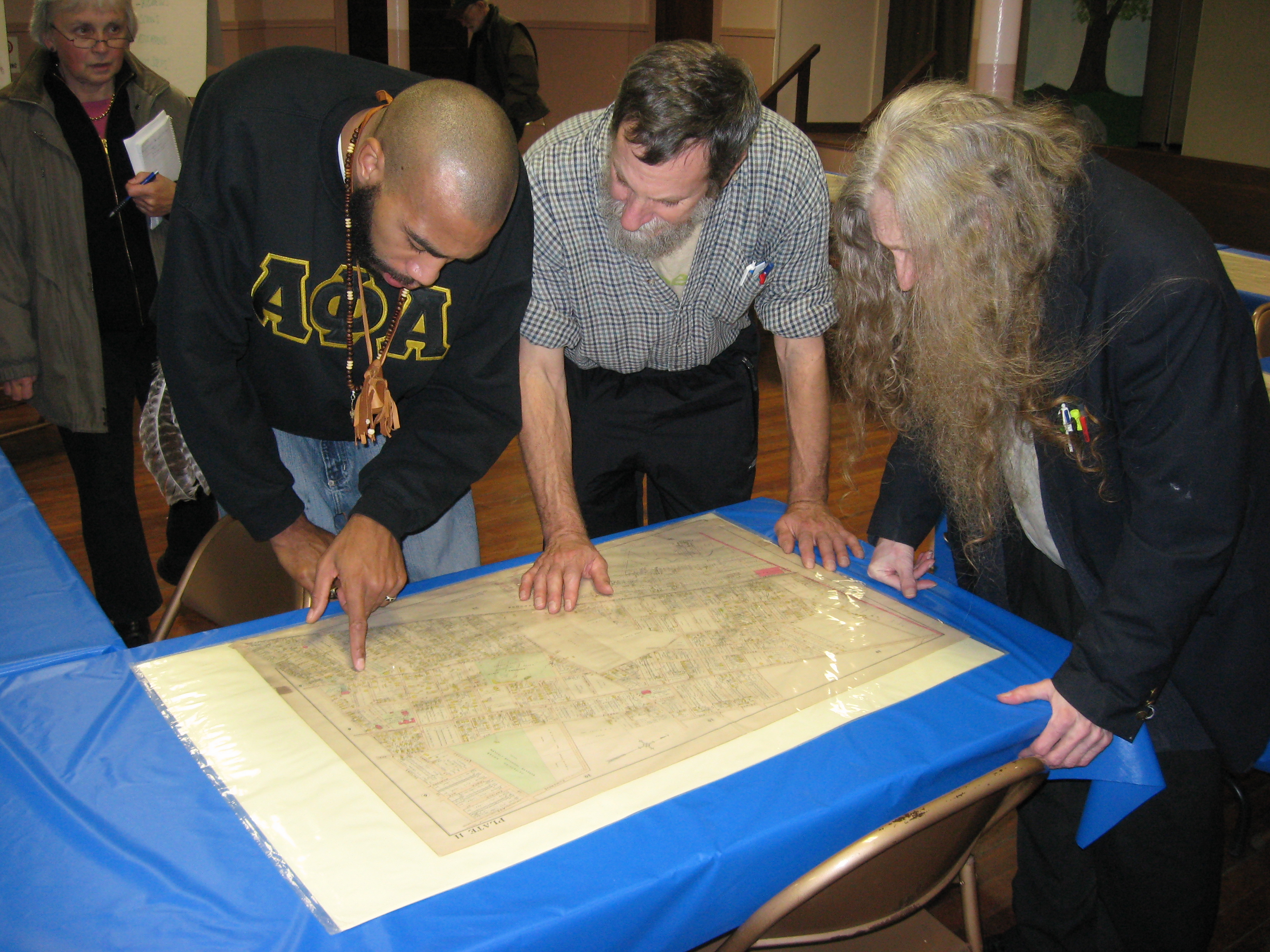 Ray Watson, Greg Gerritt and David Kolsky find their bearings on an insurance map from the early 20th century.