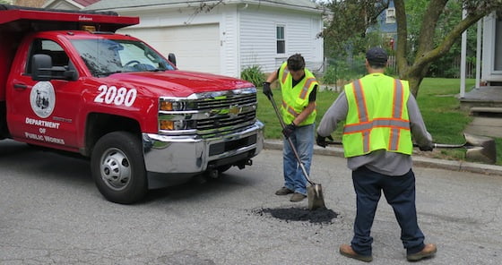A crew from the Providence Department of Public Works fills some potholes on Bayard Street. A worker said they have scouts out looking for spots that need repairs or they respond to called-in locations.